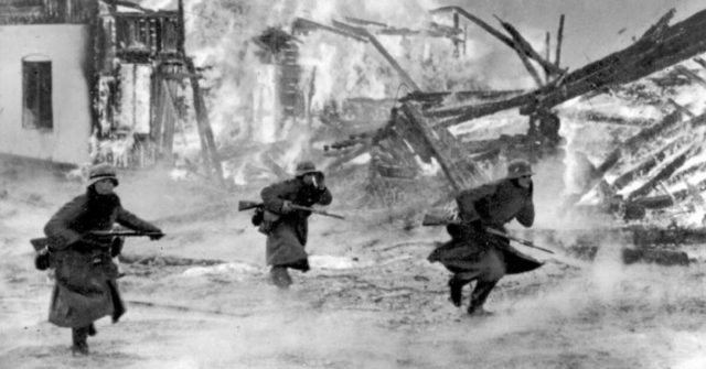 German infantry attacking through a burning Norwegian village, April 1940. By Bundesarchiv – CC BY-SA 3.0 de
