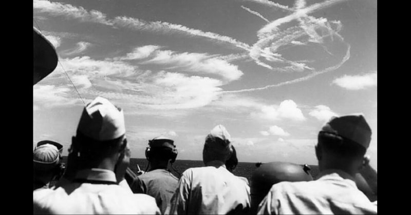 Fighter aircraft contrails mark the sky over Task Force 58, June 19, 1944