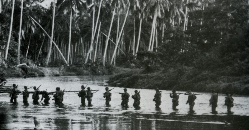 A U.S. Marine patrol crosses the Matanikau River on Guadalcanal in September 1942.
