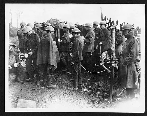 New Zealanders walking wounded at the Battle of Broodseinde ridge, the most successful Allied attack of Passchendaele. A YMCA NZ stall just behind the lines allowed the men to get something to drink.