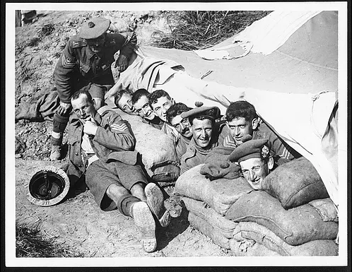 Men of the 6th Battalion, Argyll, and Sutherland Highlanders, resting beneath a tarpaulin, Ypres-Comines Canal, 1 October 1917.