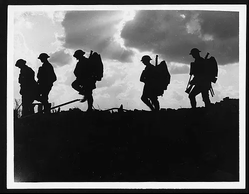 Troops moving at Eventide. Men of a Yorkshire regiment on the march. This photo was taken by Ernest Brooks.
