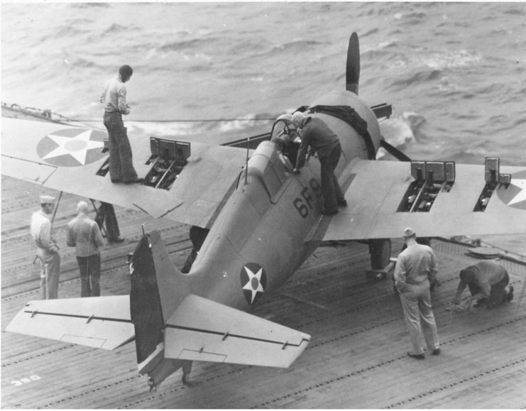 Wildcat of VF-6 testing out machine guns aboard USS Enterprise, 10 April 1942.