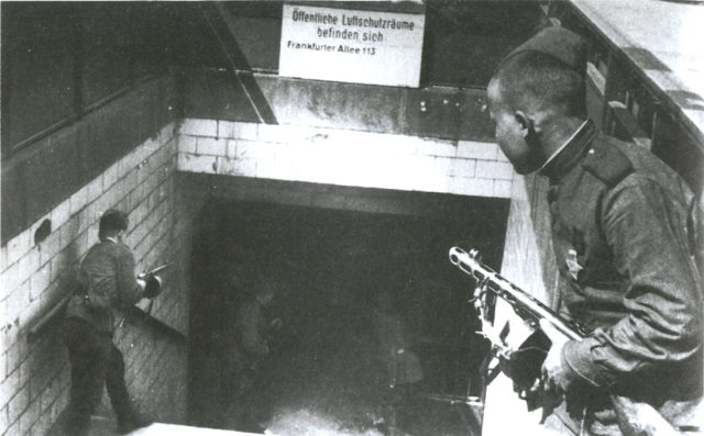 Russian soldiers with PPSh-41 submachine guns entering the Frankfurter Allee station in Berlin, Germany,April 1945.