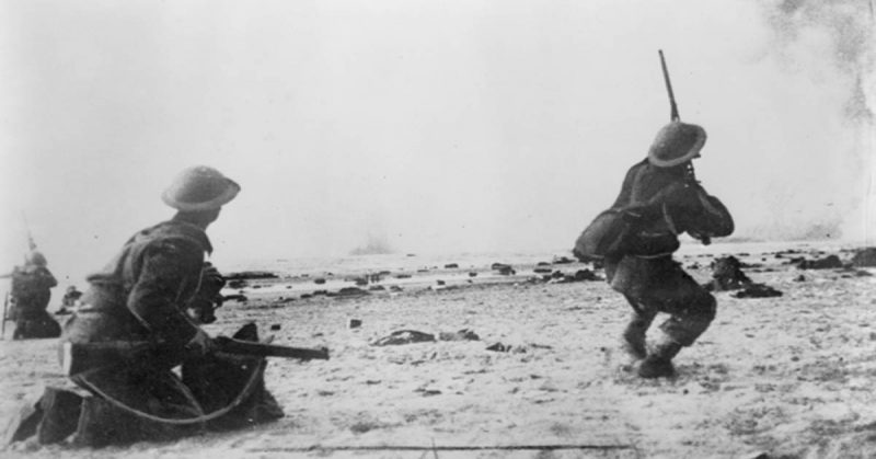 Soldiers from the British Expeditionary Force fire at low flying German aircraft during the Dunkirk evacuation.