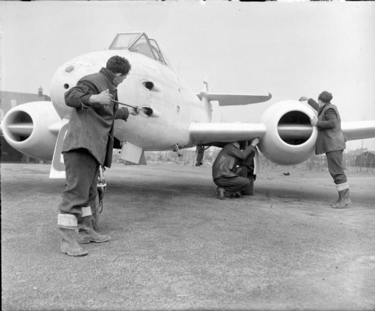 Gloster Meteor F Mark III of No. 616 Squadron RAF being services at Melsbroek, Belgium. One of the 20mm guns in the aircraft’s nose is being cleaned by an armourer.