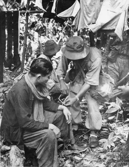 Two suspected guerillas after capture by Jungle Squad officers.