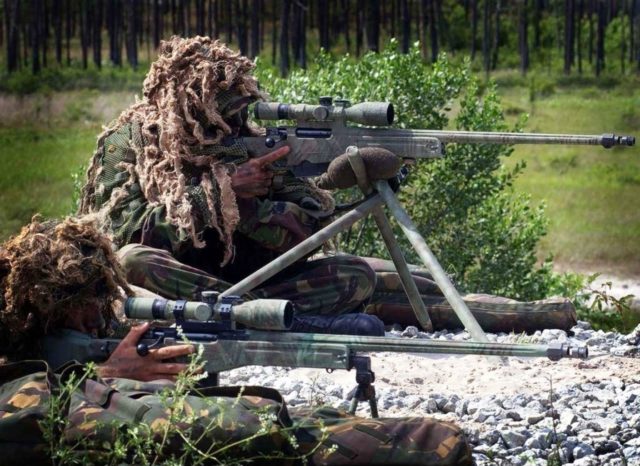 Royal Marines snipers with L115A1 sniper rifles.
