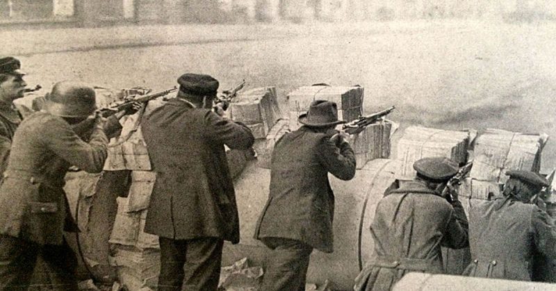 Soldiers stand behind a barricade during the Spartacist uprising.