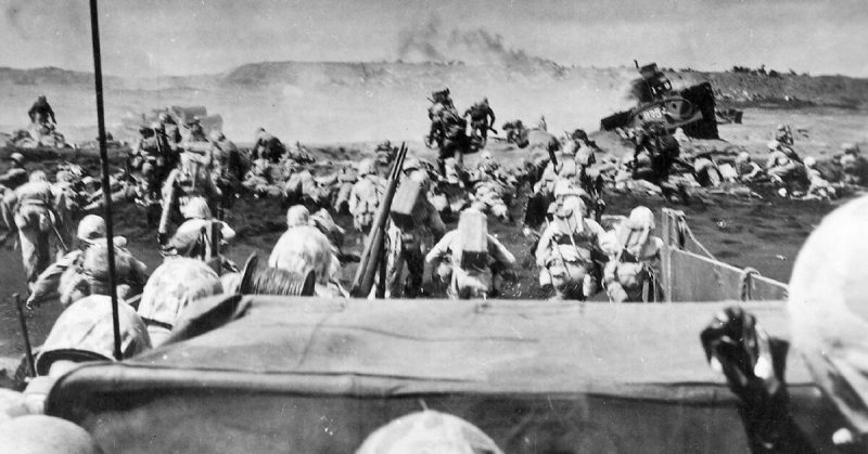 Marines land on the beach at Iwo Jima. 