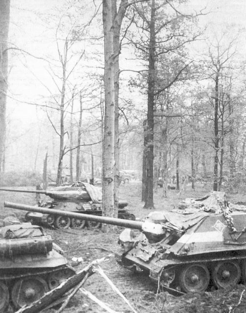 T-34-85 tank and SU-100 tank destroyer of Soviet 1st Guards Tank Army outside of Berlin, Germany, 30 April 1945.