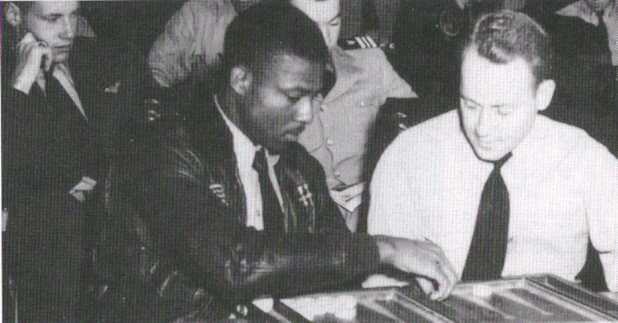 Brown in the ready room of the aircraft carrier USS Leyte (CV-32).