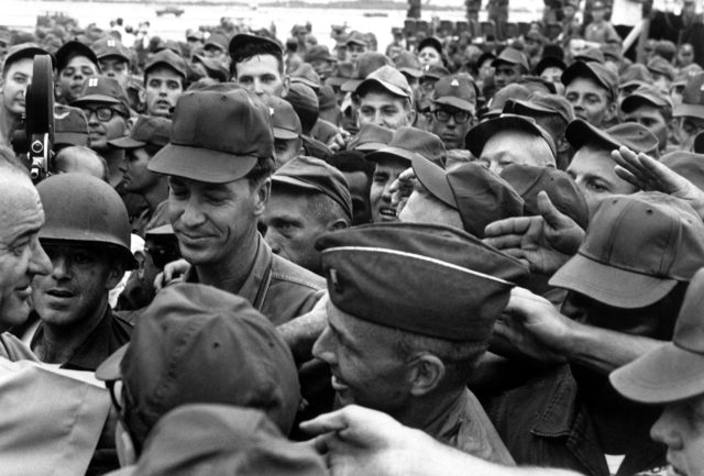 President Lyndon B. Johnson greets American troops in Vietnam.
