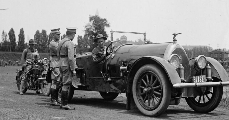 Butler sitting in car at Gettysburg during a Pickett's Charge reenactment by Marines in 1922. 