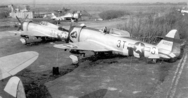 A group of P-47 Thunderbolts of the 22nd Fighter Squadron at Le Culot, Belgium in late 1944, as evidenced by the modified fuselage invasion stripes (removed from fuselage & wing upper surfaces). Loring was flying aircraft 44-19864 (left) when he was shot down over Belgium and made a Prisoner of War.