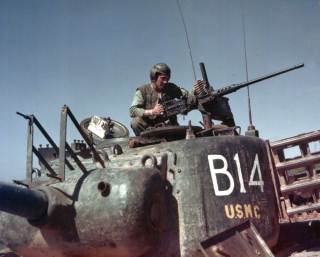 Marine loading .50 cal in Korea.