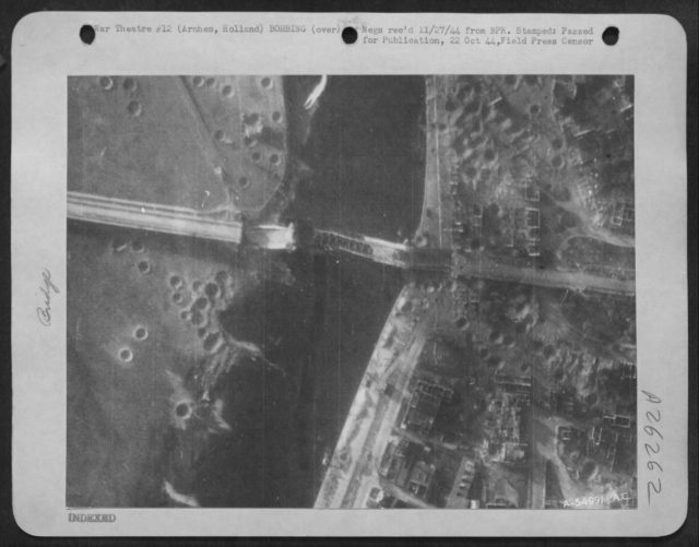 Arnhem bridge after it was destroyed. Note the bomb craters.