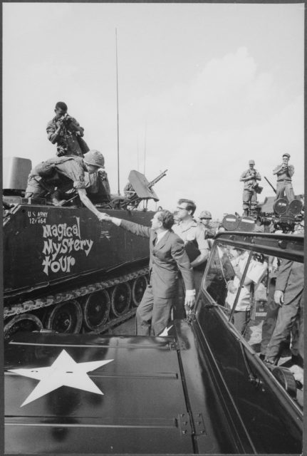 Richard Nixon shaking hands with armed forces in Vietnam, 1969.