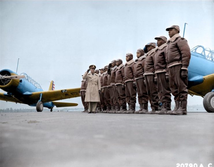 America’s First Black Airmen Had to Battle Their Own Side for the Right to Fight“Maj. James A. Ellison returns the salute of Mac Ross as he passes down the line during review of the first class of Tuskegee cadets.”Photographed by US Air Force, Tuskegee, Alabama, USA probably 1941. Colourised by Mads Madsen