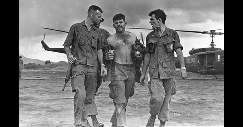 Rose being helped from a helicopter after Operation Tailwind, 14 May 1970.