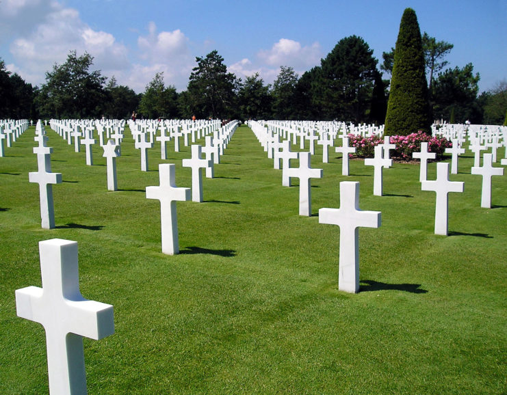 The sun shines on grave markers at the Cimetière américain de Colleville-sur-Mer, Normandy.