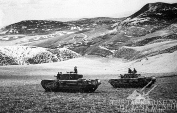 Churchill tanks keep watch during the Tunisian campaign