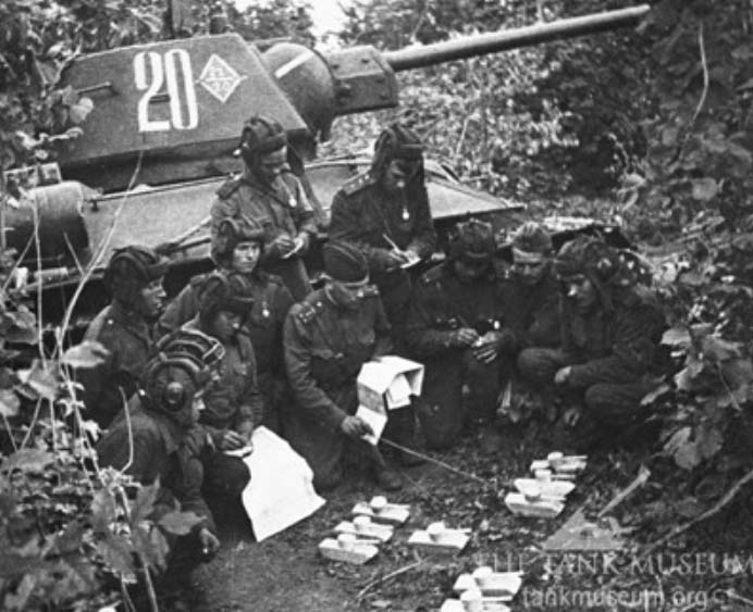 T-34 commanders are briefed by their Company Commander.