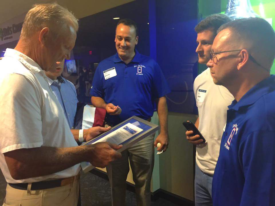 Baseball icon George Brett, left, reads the 2017 Silver Star Families of America (SSFOA) Commendation that was presented to the Kansas City Royals in recognition of the team’s support of the nation’s veterans.  Courtesy of Joy Johnson.