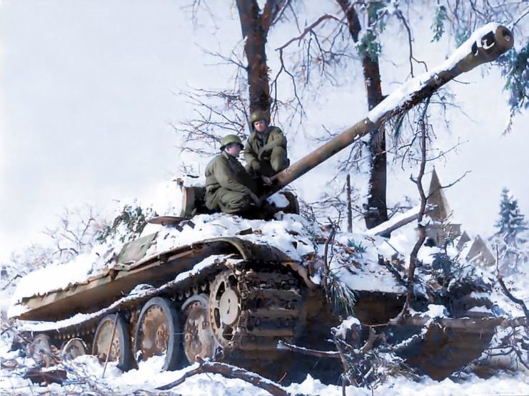 One of the German tanks Pz.Kpfw. V Panther 2 nd Division SS Das Reich killed by parts of the 3rd Panzer Division of the United States in Grandmenil, Belgium in Jan 1945. COLOURED photographs of army tanks during World War II in Nazi Germany show just how the arms race to develop the ultimate tank progressed for all sides during this most devastating of conflicts. The spectacular pictures reveal infantrymen with a tank of the 11th Armoured Division, 3rd US Army advancing through a smoke-filled street in Germany, while another image depicts the more basic M4A3 Sherman tank advancing into the center of Kronach in April, 1945. Other photographs show German artillerymen shoot Soviet tanks, while another exposes a more technically advanced and fearsome snow-covered German Panzer tank being used by two German soldiers. Further colourised images unfold the consequences of operating an army tank in the middle of a flood with a soldier trailing through the water on his motorcycle. The incredible pictures were brought to life by Royston Leonard (55), an electrician from Wales, UK, who took the time to carefully colourise the photographs, highlighting the true occurrence of the war and the weapons used. Royston Leonard / mediadrumworld.com