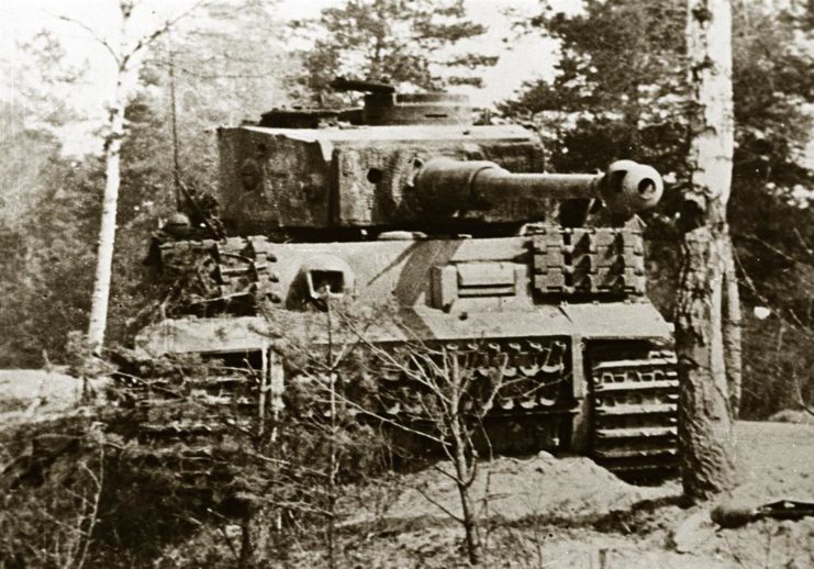 Another view of the knocked out Tiger. Notice the location of the remaining headlamp and the extra lengths of track, very similar to the tank knocked out in Tunisia in 1943.