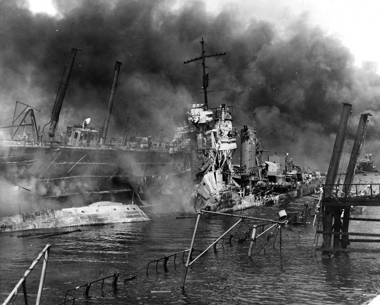 The U.S. Navy destroyer USS Shaw (DD-373) wrecked in floating drydock YFD-2 on 7 December 1941, with fires were nearly out but structure still smoking.