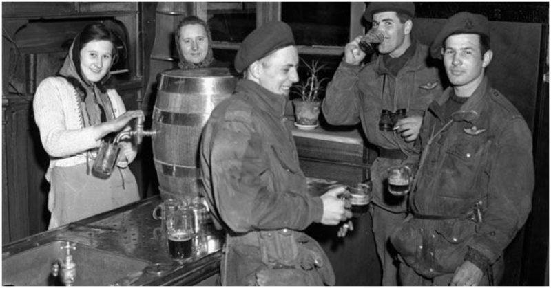 Personnel of the 1st Canadian Parachute Battalion having free beer at a local inn, Lembeck