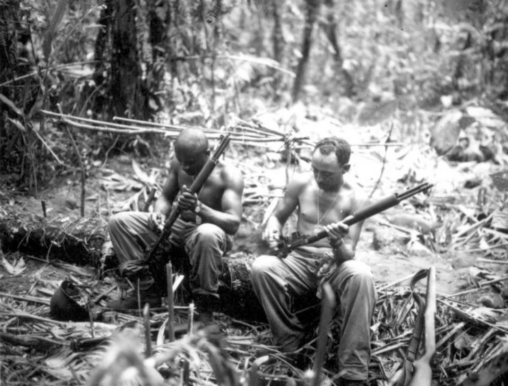 US Soldiers clear their rifles, April 1944.