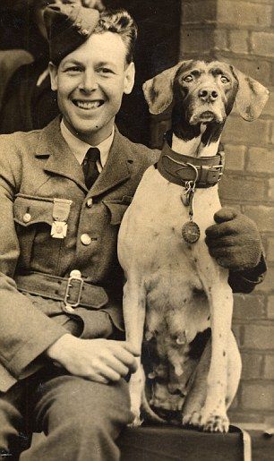 Judy with her protector Frank Williams, wearing the animal version of the VC round her neck