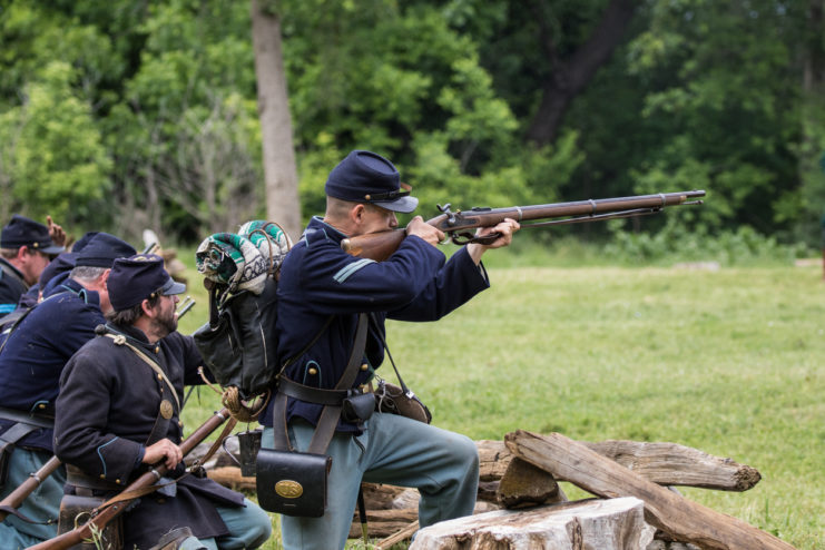 Red Bluff, California, United States-April 24, 2016: Union troops return fire at the Dog Island Civil War Reenactment.