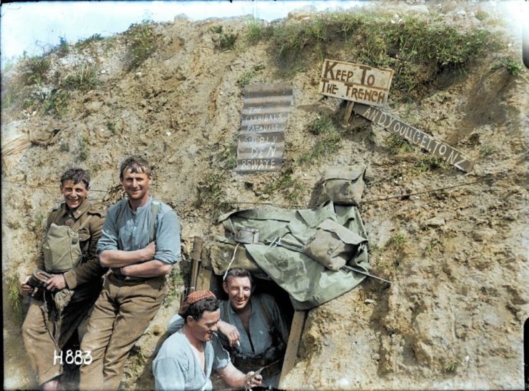 New Zealand troops on the Western Front smile for the camera from their trench. Photo colourised by Royston Leonard / mediadrumworld.com