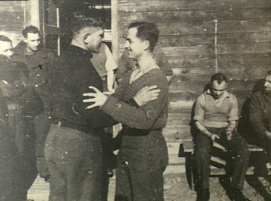 Private Ralph Churches (right foreground) at a work camp, after an earlier escape attempt.