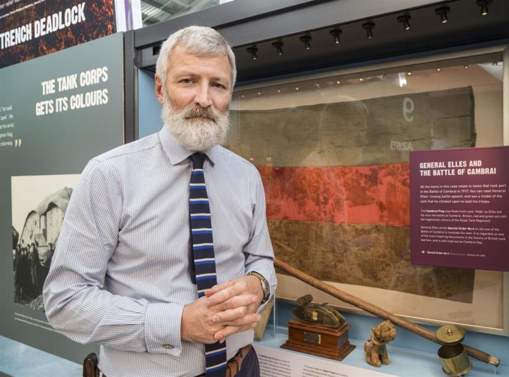 Tank Museum curator David Willey with the Cambrai Flag