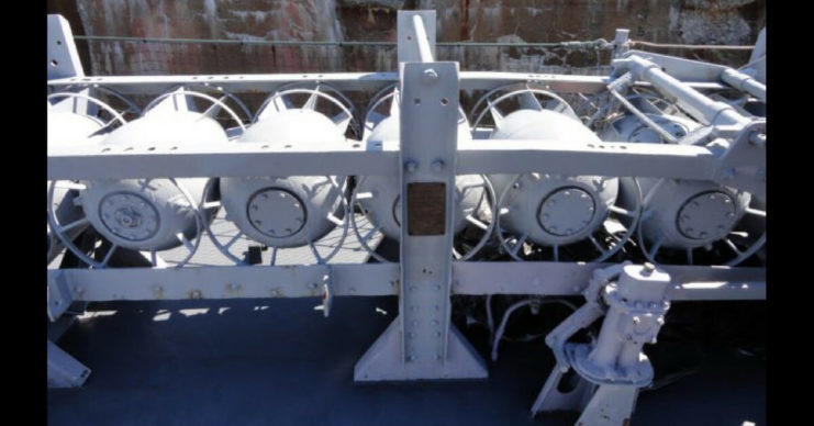 Depth charges on their tracks aboard the USS Cassin Young. Ktr101 – CC-BY SA 3.0