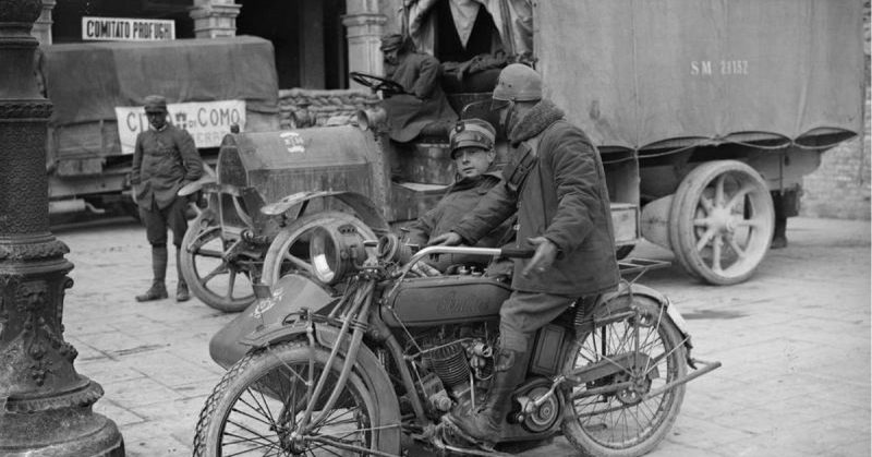 Two Italian army officers with an Indian sidecar motocycle.