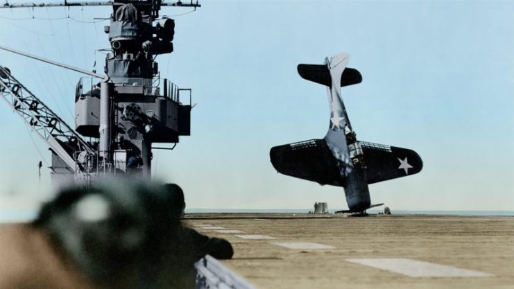 Douglas SBD “Dauntless” dive bomber balanced on nose after crash landing on carrier flight deck, June 21, 1943. Paul Reynolds / mediadrumworld.com
