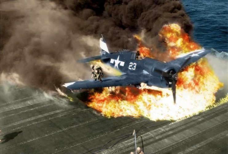 The pilot of a U.S. Navy F6F Hellcat escapes after a crash landing on the USS Lexington aircraft carrier, 1945. Paul Reynolds / mediadrumworld.com
