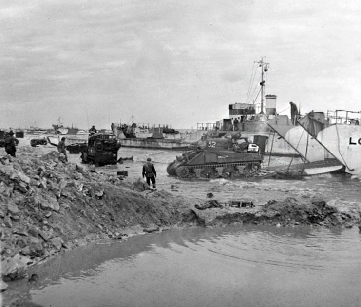 A Sherman Tank moves ashore at Gold Beach.