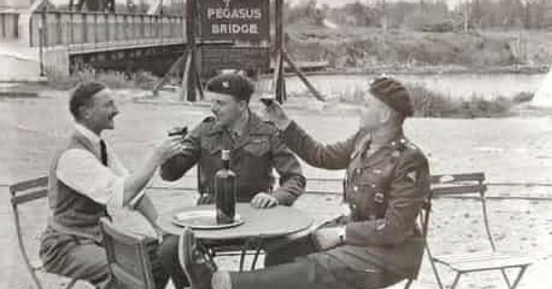 1946 photo of Pegasus Bridge with, from left, Georges Gondree the Proprietor of Cafe Gondree - now the Pegasus Bridge Cafe, Major John Howard DSO and Capt. David Wood. 