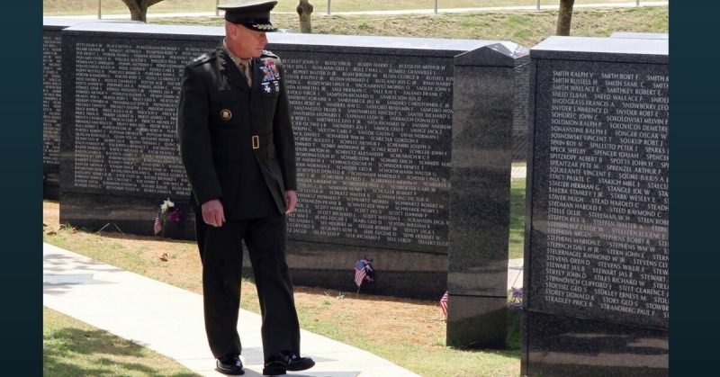 Lt. Gen. Kenneth J. Glueck Jr., commanding general of III Marine Expeditionary Force and commander of Marine Corps Bases Japan, looks at names on the Cornerstone of Peace at Okinawa Peace Memorial Park in Itoman City, during the 2011 Okinawa Memorial Service for All War Dead June 23.