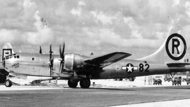 Enola Gay after Hiroshima mission, entering hard-stand. It is in its 6th Bombardment Group livery, with victor number 82 visible on fuselage just forward of the tail fin.