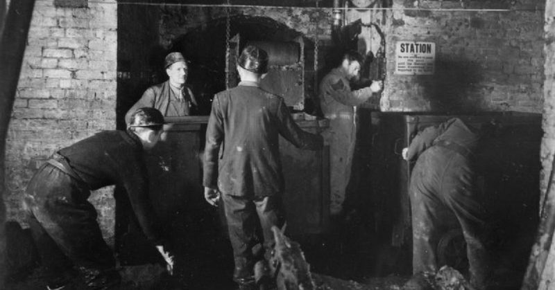 Bevin Boys receiving training from an experienced miner at Ollerton, Nottinghamshire, February 1945.