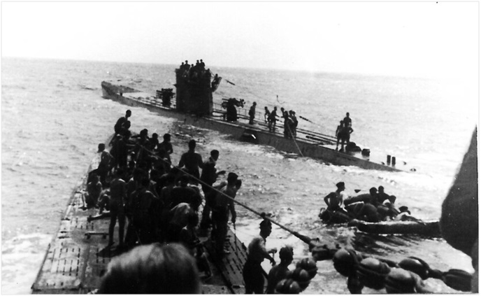 The U-507 (background) on September 15, 1942, shortly after its incursion on Brazilian shore. The crew of the submarine assists in the rescue of the shipwrecked survivors of RMS Laconia. (Wikimedia Commons)