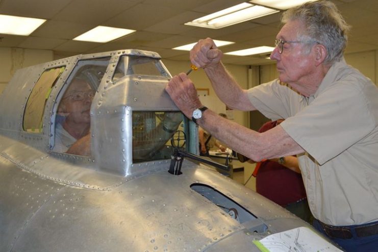 Museum volunteers working on the “Memphis Belle” in the restoration hangar at the National Museum of the U.S. Air Force. (U.S. Air Force photo)