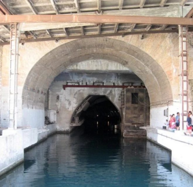 Entrance tunnel to old Soviet submarine base. Russianname – CC BY 3.0